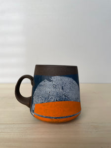 Blues and orange mug