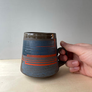 Mazarine and flame orange coffee mug