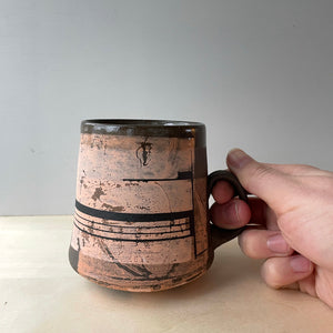 Peach and black coffee mug