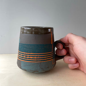 Sea green and orange coffee mug