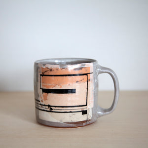 Peach and black mug