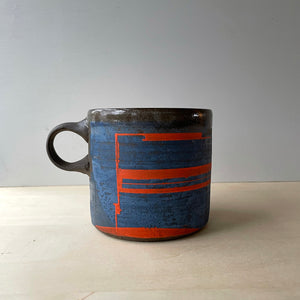 Mazarine and flame orange coffee mug