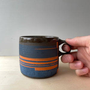 Mazarine and orange coffee mug